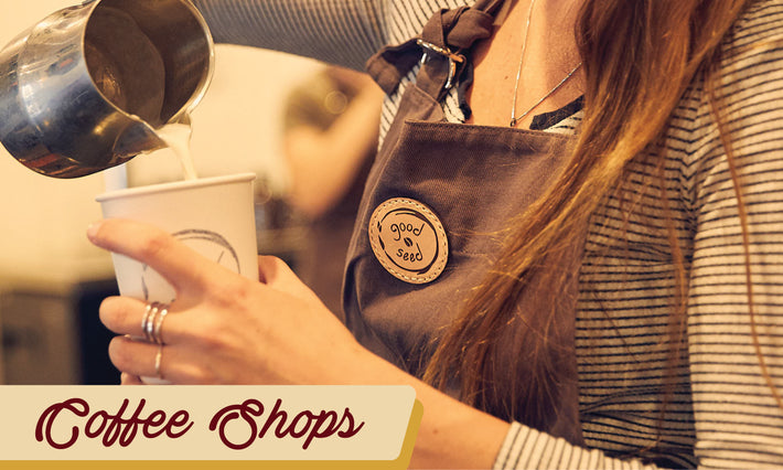 Custom leather patch apron featured in the coffee shop industry with girl pouring coffee into cup