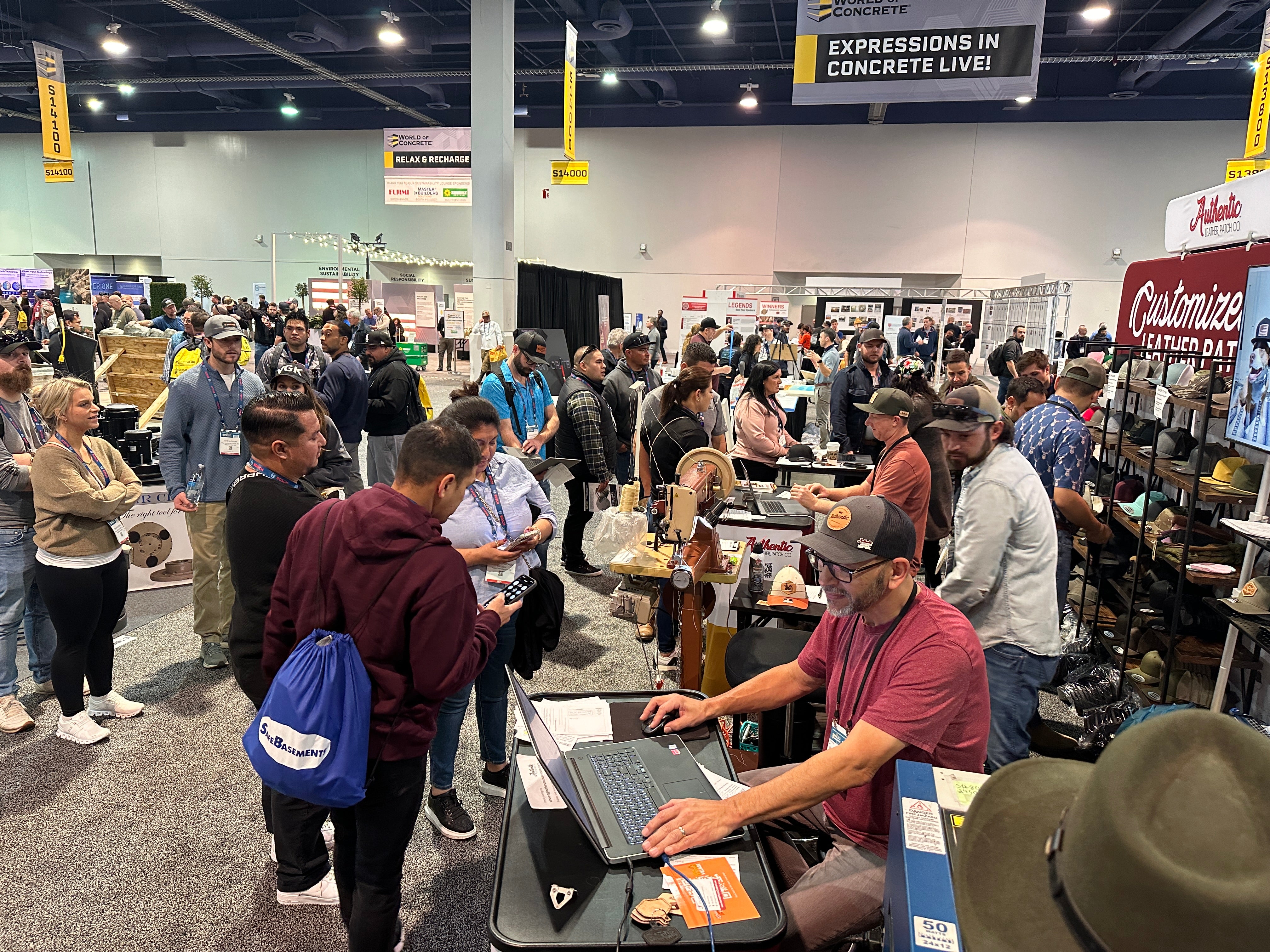 our team making custom leather patch hats at the 2024 World of Concrete tradeshow