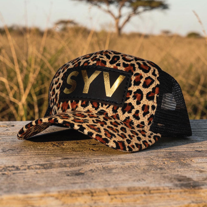 SYV gold foil leather patch hat on a cheetah print hat 
