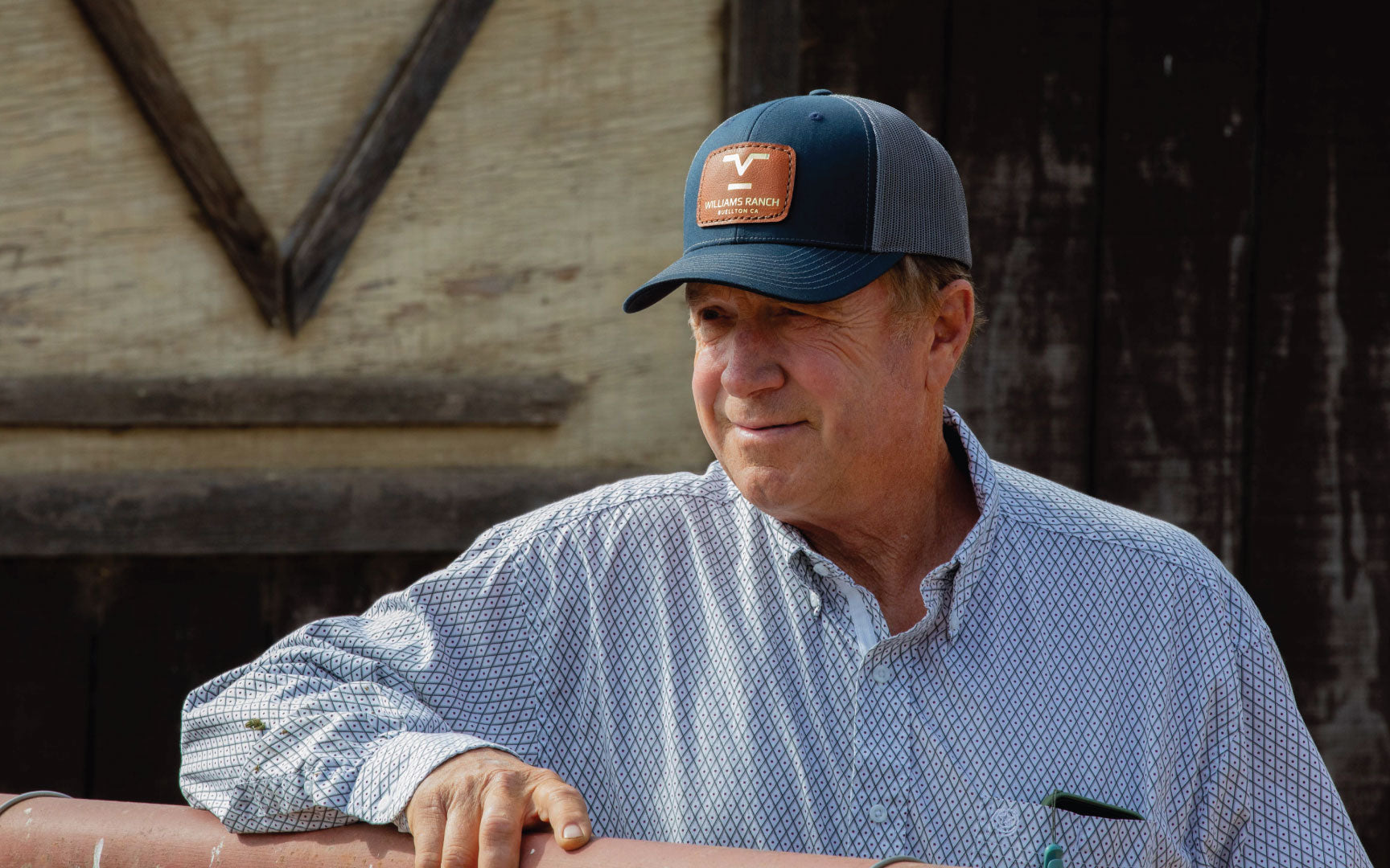 Williams Ranch wearing his custom leather patch hat at the barn