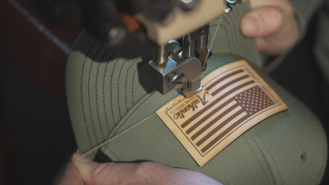 video of a American Flag leather patch getting sewn onto a Richardson 112 Loden/Black hat
